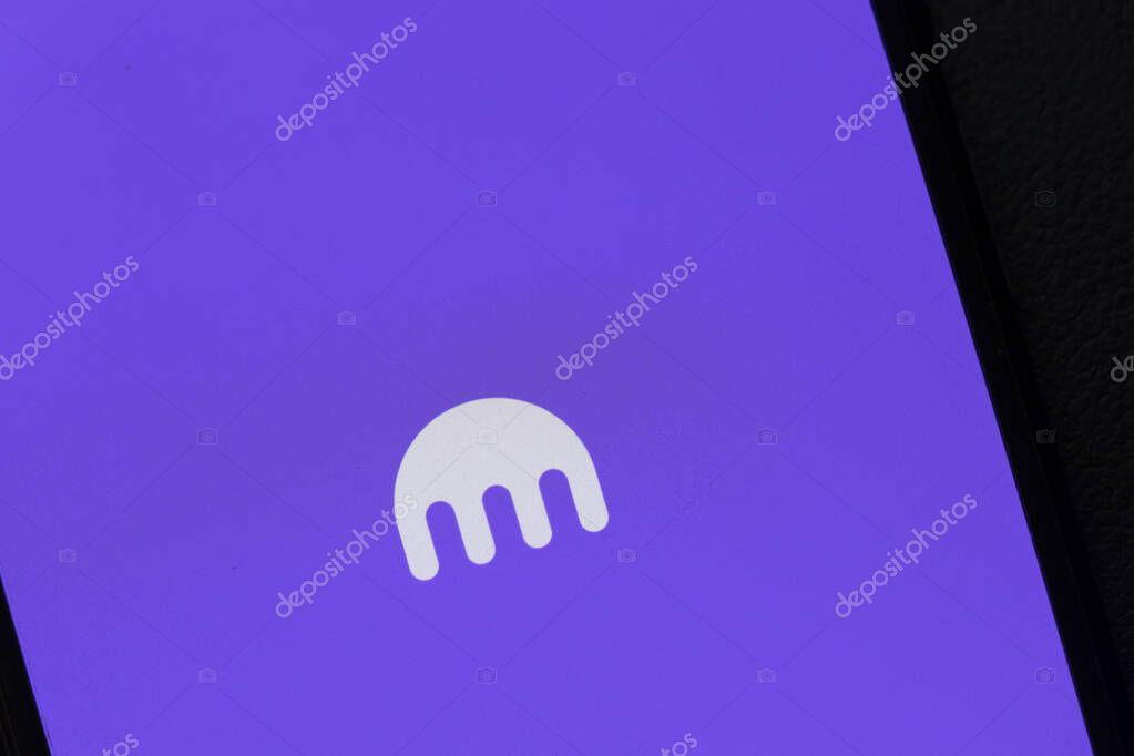 Warsaw Poland - September 24 2025: The Kraken cryptocurrency exchange logo displayed on a smartphone against a vibrant purple background symbolizing finance and trading.