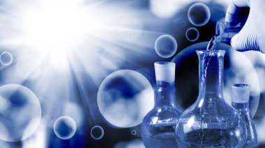 İçine dökülen bir mataranın ve sıvının soyut görüntüsü bilimsel biyolojik araştırma kavramını ima ediyor.