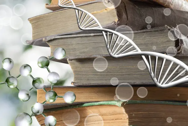 Yeşil bulanık arkaplanda bir yığın kitap ve biçimlendirilmiş DNA modelinin resmi