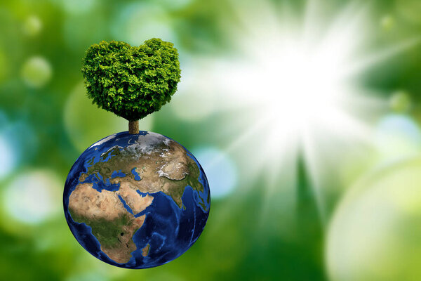 A heart-shaped tree flourishes atop a globe, representing unity and love for the planet.