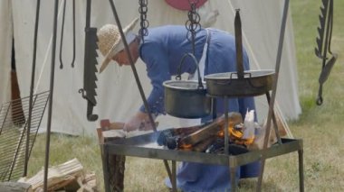 Scenes in medieval costume, a priest smiling at the Trecentesca festival on June 21, 2022 in Morimondo, Italy