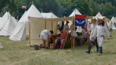Scenes in medieval costume, peasants walking in a medieval camp on June 21, 2022 in Morimondo, Italy