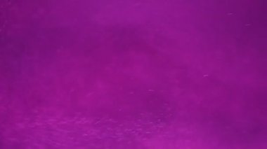 Hareketli altın parıltıları olan soyut arkaplan 