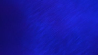 Hareketli altın parıltıları olan soyut arkaplan 