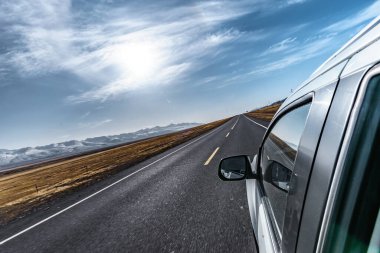 Driving on the road in Xinjiang Scenic Area clipart