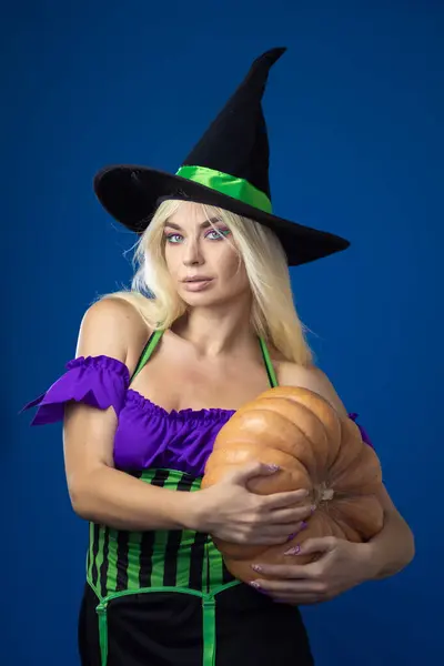 Young Beautiful Blonde Woman Witch Costume Blue Background Holds Large — Stock Photo, Image