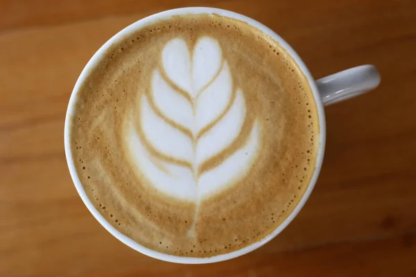 Art of drawing in milk with coffee in the shape of nature