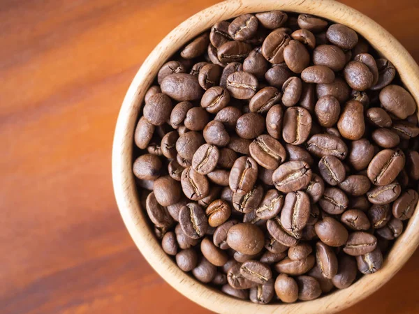 stock image brown arabica coffee bean roast level medium taste delicate lively bright seed caffeine espresso drink food cafe beverage Chiang Rai, Thailand coffee on wooden table background top view selected focus