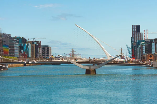 Discovering Ireland concept. A view to Samuel Beckett Bridge over River Liffey in Dublin city. Sunny day. Text space. Outdoor shot