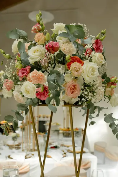 Wedding table with favors and flowers. Elegance wedding decor. Selective focus.