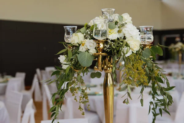 Wedding table with favors and flowers. Elegance wedding decor. Selective focus.