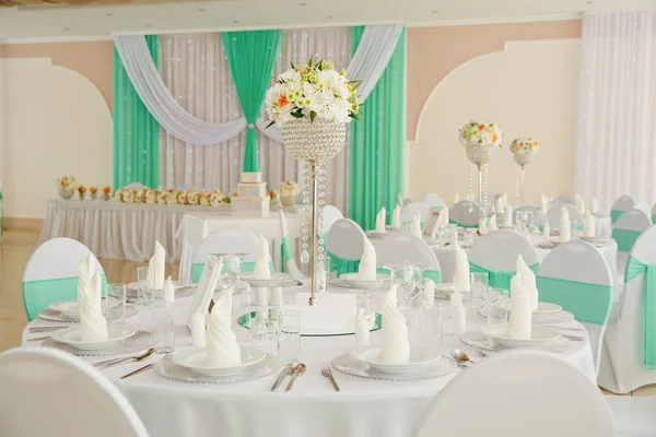 Wedding table with favors and flowers. Elegance wedding decor.