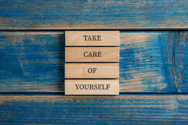 Take Care Yourself Sign Written Four Stacked Wooden Pegs Placed — Stock Photo, Image
