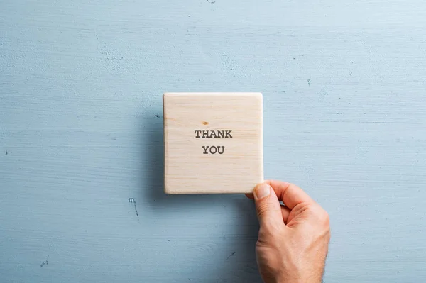 Male Hand Placing Wooden Tile Thank You Sign Light Blue — Stock Photo, Image