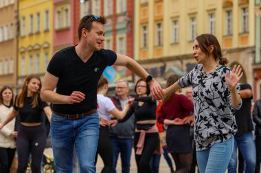 Wroclaw, Poland - April 2022: A lot of people dancing Rueda de Casino open event at market square