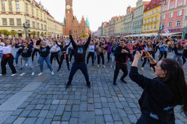 Wroclaw, Poland - April 2022: A lot of people dancing Rueda de Casino open event at market square