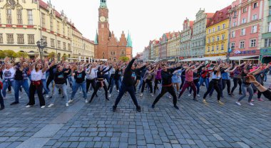 Wroclaw, Poland - April 2022: A lot of people dancing Rueda de Casino open event at market square