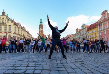 Wroclaw, Poland - April 2022: A lot of people dancing Rueda de Casino open event at market square