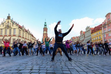 Wroclaw, Poland - April 2022: A lot of people dancing Rueda de Casino open event at market square