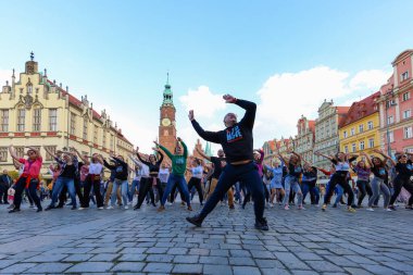 Wroclaw, Poland - April 2022: A lot of people dancing Rueda de Casino open event at market square