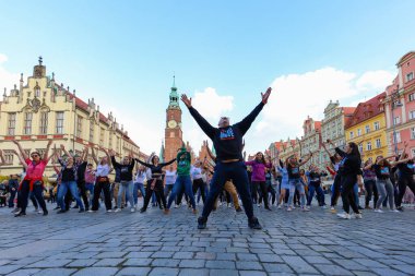 Wroclaw, Poland - April 2022: A lot of people dancing Rueda de Casino open event at market square