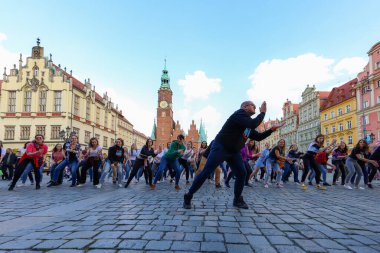 Wroclaw, Poland - April 2022: A lot of people dancing Rueda de Casino open event at market square