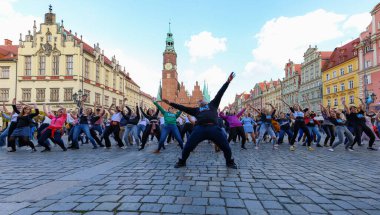 Wroclaw, Poland - April 2022: A lot of people dancing Rueda de Casino open event at market square