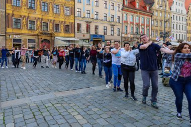 Wroclaw, Poland - April 2022: A lot of people dancing Rueda de Casino open event at market square