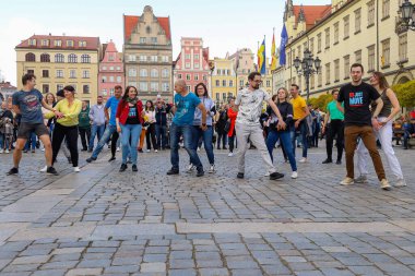 Wroclaw, Poland - April 2022: A lot of people dancing Rueda de Casino open event at market square