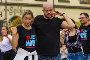 Wroclaw, Poland - April 2022: A lot of people dancing Rueda de Casino open event at market square