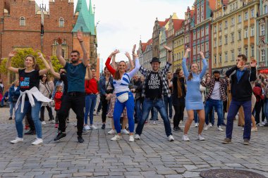 Wroclaw, Poland - April 2022: A lot of people dancing Rueda de Casino open event at market square