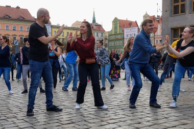 Wroclaw, Poland - April 2022: A lot of people dancing Rueda de Casino open event at market square
