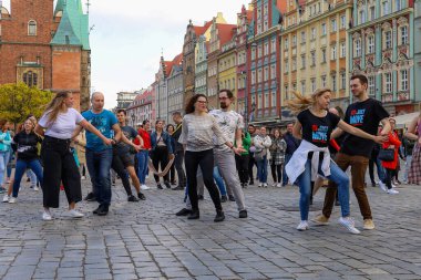 Wroclaw, Poland - April 2022: A lot of people dancing Rueda de Casino open event at market square