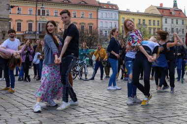 Wroclaw, Poland - April 2022: A lot of people dancing Rueda de Casino open event at market square