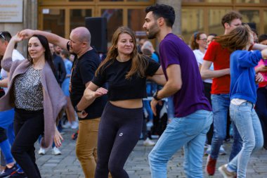 Wroclaw, Poland - April 2022: A lot of people dancing Rueda de Casino open event at market square