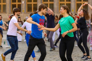 Wroclaw, Poland - April 2022: A lot of people dancing Rueda de Casino open event at market square
