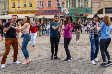 Wroclaw, Poland - April 2022: A lot of people dancing Rueda de Casino open event at market square