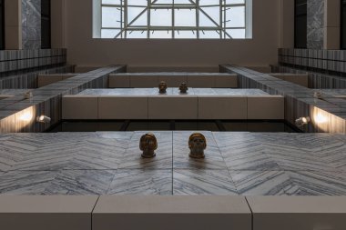 Wroclaw, Poland - April 2022: Beautiful renovated interior of Renoma shopping mall with golden chandeliers and huge skylight