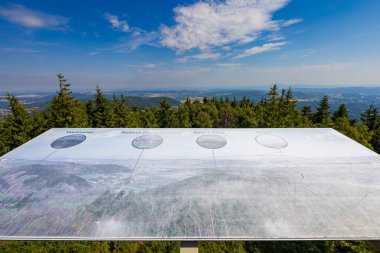 Walbrzych, Poland - August 14 2023: Beautiful panorama of Walbrzych mountains seen from top of viewing tower on top of Borowa mountain with info boards at edges of tower
