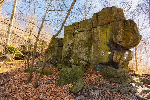 stock image Few small and giant rock formations next to mountain trail at sunny day at winter