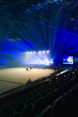 Wroclaw, Poland - March 7 2024: Interior of big main stage inside of Orbita concert hall highlighted with a lot of colorful lights before Hillsong London and niemaGOtu worship concert  clipart