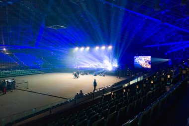 Wroclaw, Poland - March 7 2024: Interior of big main stage inside of Orbita concert hall highlighted with a lot of colorful lights before Hillsong London and niemaGOtu worship concert  clipart