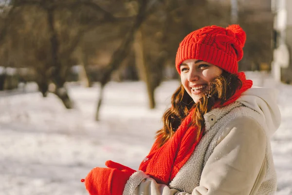 stock image A beautiful woman in winter clothes is enjoying the winter. Christmas and New Year celebration concept.