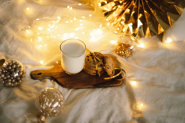 Christmas cookies and glass warm milk. Winter holiday Santa breakfast. Christmas holiday celebration. New Year concept.