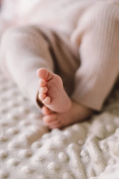 Details of the foot of a one month old baby, female. Photo depicts details of the newborns feet and toes.