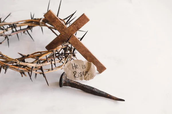 He is Risen. Jesus Crown Thorns and nails and cross on a white background. Crucifixion Of Jesus Christ. Passion Of Jesus Christ. Concept for faith, spirituality and religion. Easter Day