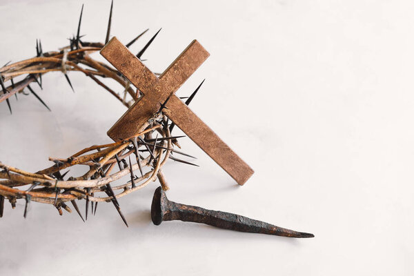Jesus Crown Thorns and nails and cross on a white background. Crucifixion Of Jesus Christ. Passion Of Jesus Christ. Concept for faith, spirituality and religion. Easter Day