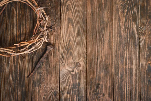 Jesus Crown Thorns and nails and cross on a wood background. Crucifixion Of Jesus Christ. Passion Of Jesus Christ. Concept for faith, spirituality and religion. Easter Day