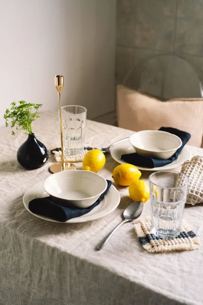 stock image Vintage table setting with Linen napkins and yellow lemons. Decoration table. Close up. Cozy calm meal in the morning in the sunshine.