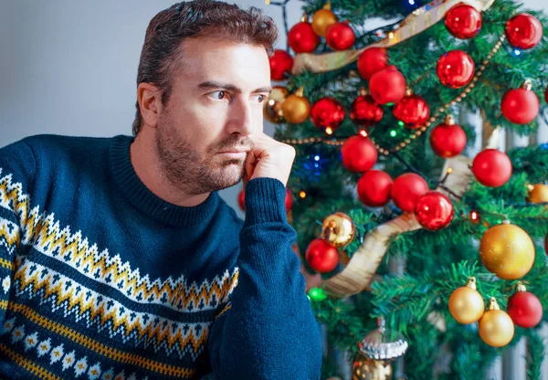 stock image Man feeling depressed during christmas holiday celebration